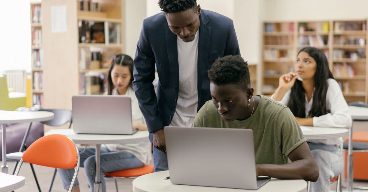 Tablets and laptops on classroom desks