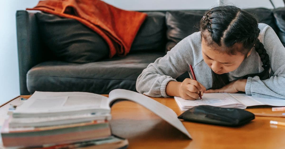 A child's workbook, pencil and study desk