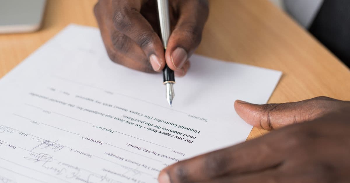 A fountain pen and documents on an office desk