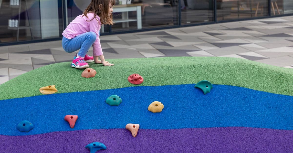 Kids playing on a colorful playground